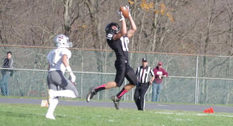 Wallkill Valley wideout Jon Sienkiewicz catches the ball from 50 yards out and eventually outruns Newton defensive back Nico Sebastiano to score a touchdown in the fourth quarter.