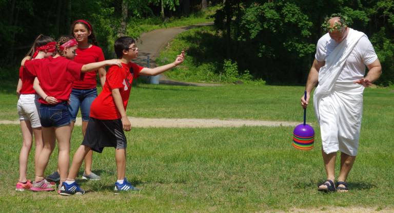 Hamburg hosts Greek Olympics A member of the Spartan team tries to get history teacher Michael BlochingerþÄôs attention.