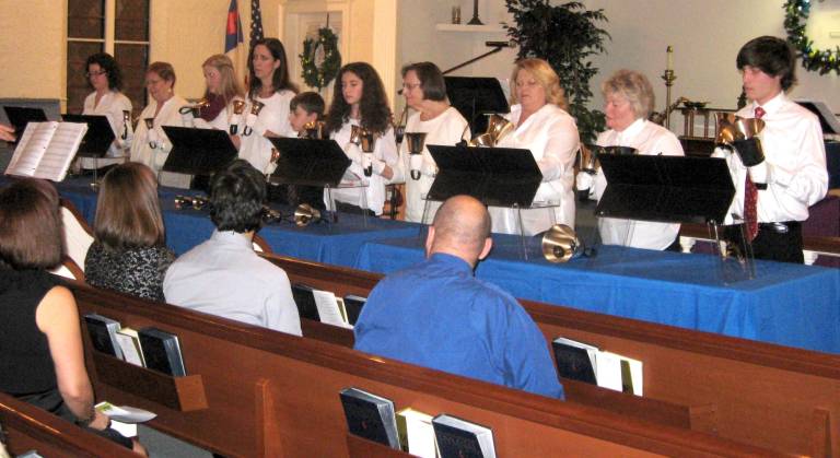 The newly reformed bell choir included the young and the more mature.