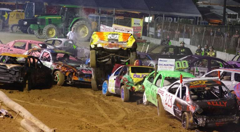 Cars bounce around at demolition derby A car went airborne and landed on top of Thomas Hickey's 2001 Grand Am (72).