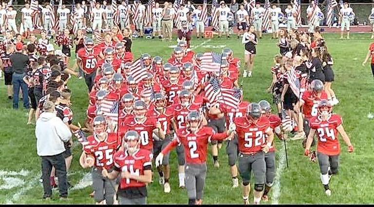 The Wildcats run off the field in triumph during the 2021 season.