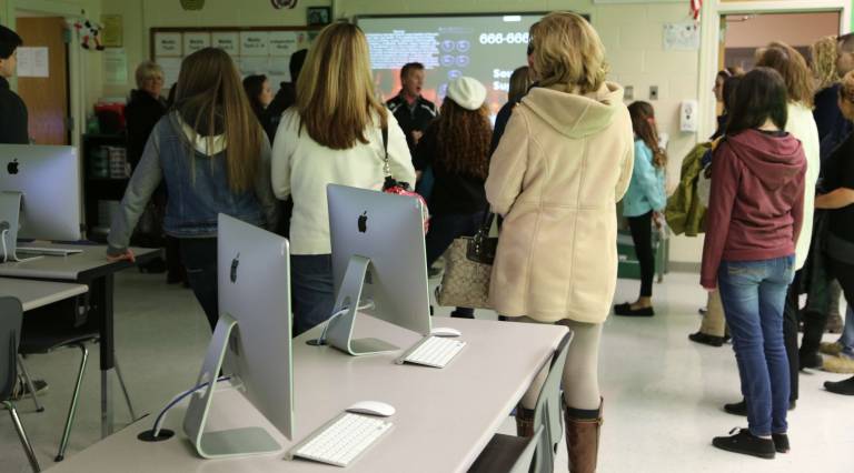 Parents and future High Point students learn about the media programs at the open house.