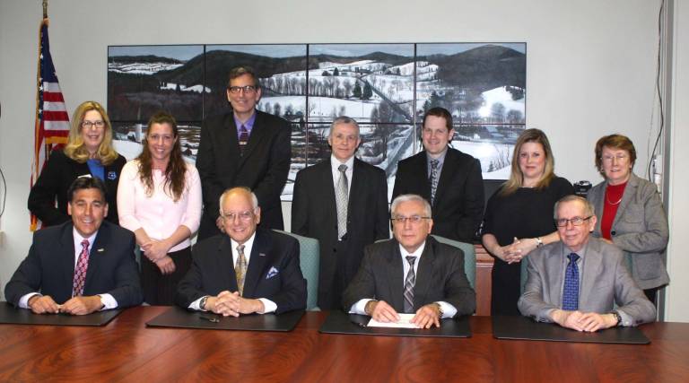 From left to right seated FDU University Provost and Sr VPAA Chris Capuano, FDU President Sheldon Drucker, SCCC President Dr. Paul Mazur, SCCC VPAA William Waite; Standing from left to right: SCCC Dean Mary Ellen Donner, SCCC VP of Institutional Advancement Karen DiMaria, FDU Director of Community College Partnerships Anthony Mastropietro, SCCC Executive VP of Finance and Operations Frank Nocella, SCCC Transfer Counselor Scott Scardena, SCCC Dean Dr. Kathleen Okay, Associate Dean of Academic Affairs Alberta Jaegar.