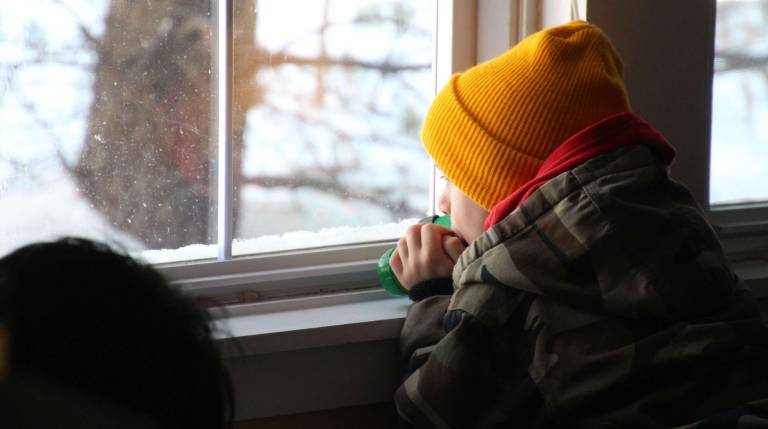 Travis Blaum of Vernon waits patiently for birds to land at the bird feeder outside the window of the Wallkill River National Wildlife Refuge.