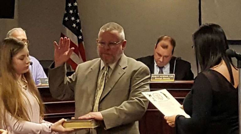New Franklin police officers sworn in Council Member Gilbert Snyder takes Oath of Office.
