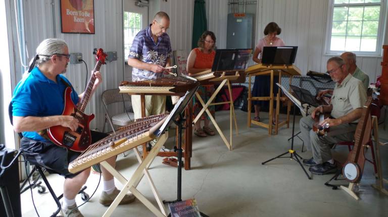 The Rockaway Dulcimer Ensemble is shown performing at the Sussex County Framers&#xfe;&#xc4;&#xf4; Market. Each weekend there is much more than just fruit and vegetables to enjoy at the market.