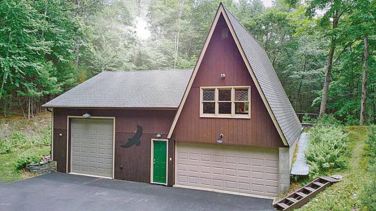 One-of-a-kind retreat on 13+ acres with trout stream Garage