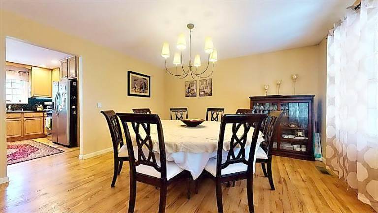 Modern four-bedroom colonial has room to roam Dining room