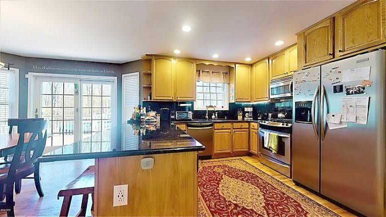 Modern four-bedroom colonial has room to roam Kitchen