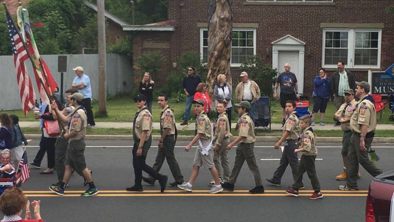The Boy Scouts of Franklin Troop 90 marched in Franklins Memorial Day parade. Miss Franklin and Junior Miss Franklin rode the fire truck. Members of the Feanklin Fire Department listen during the services. The Memorial wreath is layed at the monument and the Franklin band plays on.