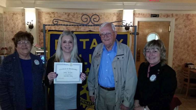 New member for Wallkill Valley Rotary Club. Mrs. Stacey Springer was inducted into the Wallkill Valley Rotary Club. Pictured are: Sharon Walsh, incoming Club President, Stacey Springer, new member, Fred Kattermann, Club Rotarian sponsor, and Karen McDougal, Club President.
