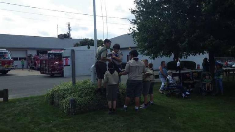 Boy Scout Troop 187 prepares to raise the flag to open the field events at Ogdensburg Day on Sept 20. The boys also participated by marching in the parade.