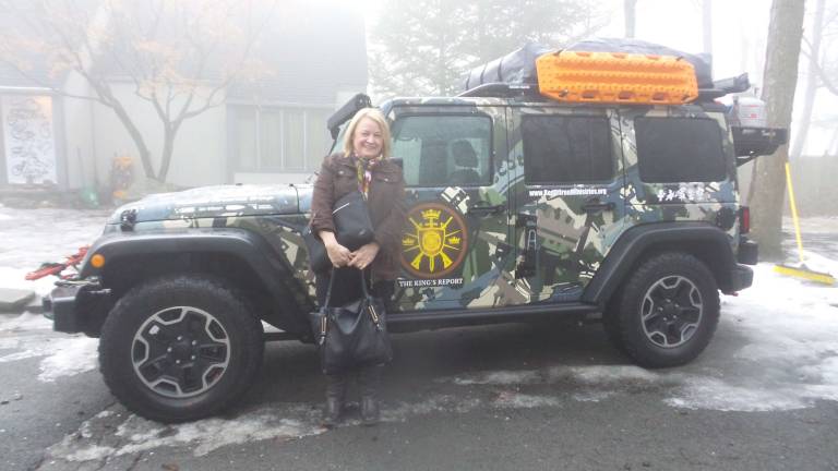 Local church to hold four-day celebration of assault rifles Sean Moon’s jeep designed and gifted to him by Kahr Arms. Sean Moon’s secretary, Lordes Swars, stands in front of the jeep. (Photo by Frances Ruth Harris)