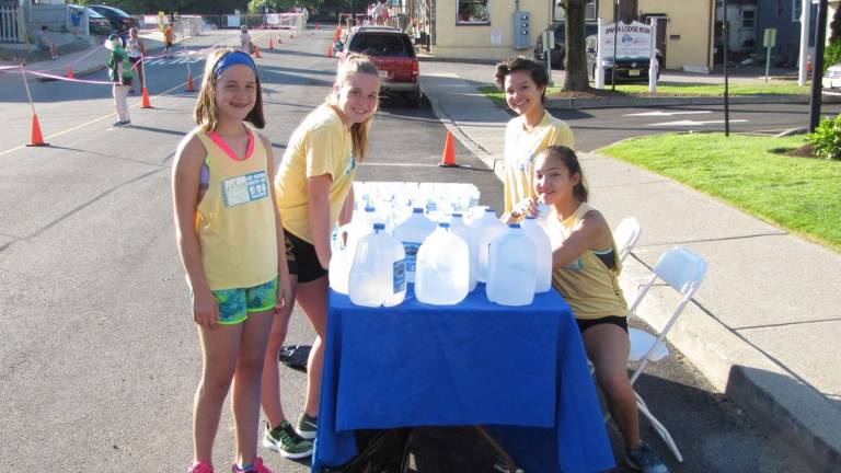 Past triathlon volunteers, from left, sisters Lucy Battista and Chloe Battista of Tinton Falls, and sisters Julia Young and Rachel Young of Sparta.