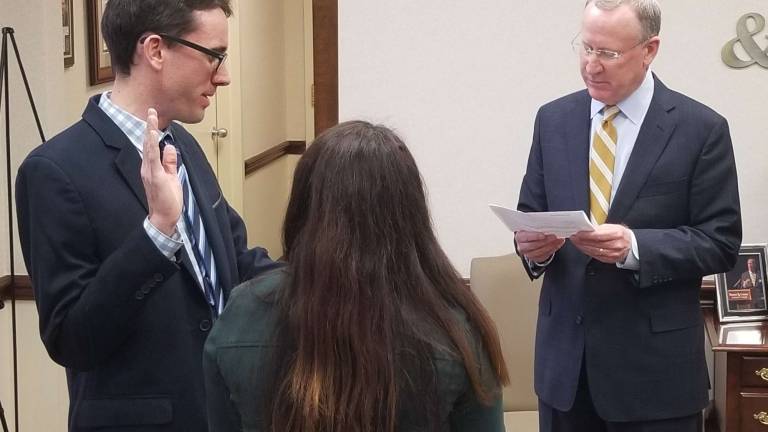 Son of firm's founder sworn in Son of firm's founder sworn in