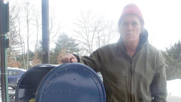 Ray Lines of Wantage, who is retired from the U.S. Postal Service, is pictured next to the Wantage Post Office drop box (Photo by Frances Ruth Harris)