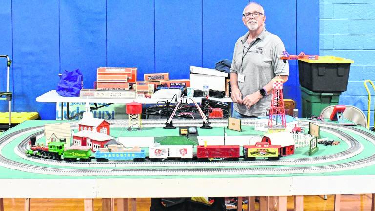 Rich Schubert of Byram poses behind a train setup.