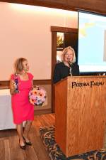 Tammie Horsfield, left, president of the Sussex County Chamber of Commerce, holds the Woman of the Year award for Deborah Berry-Toon, executive director of Project Self-Sufficiency. (Photos by Maria Kovic)