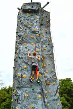 Leo Restrepo of Hamburg climbs a rock wall at Hamburg Day on Sunday, Aug. 24. (Photos by Maria Kovic)