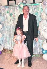 Strider and Rhianna Devore are shown under the arch.