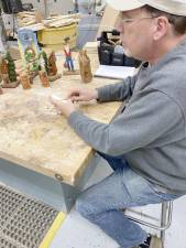 Bill Brunner works on a carving during a meeting of the Jersey Hills Wood Carvers at Jefferson Township High School. (Photos by Noah Pagella)
