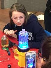 A participant in the 2016 Dream Day event, learning with Johnson &amp; Johnson how to makme a lava lamp. Photo from archive