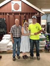 Sussex County Board of Agriculture president Mike Burger and Natalie Burger present Joseph Gigante of Andover with the Gracie’s Scholarship $500 check toward his education. (Photo provided)