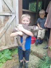 Hunter Schmick with one of his pet goats (Photo provided)