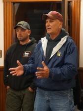 On right, Ogdensburg Fire Chief Rick Keslo offers to inform the fire department county association.