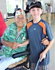 Herb Weatherwallks (1917 – 2016) visits with Alex Cohen, age 10, in 2010 at the USS Arizona Memorial in Hawaii.