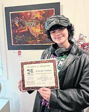 Sammy Barbato with their piece, Greasy Spoon.