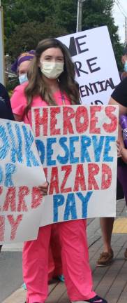 Caitlin Rollman, who now has Covid, picketed along with colleagues when they did not receive hazard pay for working through the first wave.