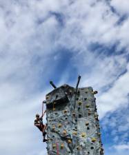 HD1 Ryan Rogers, 9, of Hamburg reaches the top of the rock wall at Hamburg Day 2023 on Sunday, Sept. 17. (Photos by Ava Lamorte)