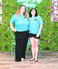 Ashlyn Szilva, owner, and Maya Gordon, assistant manager, of Black Dog Books in Lafayette pose for a photo.