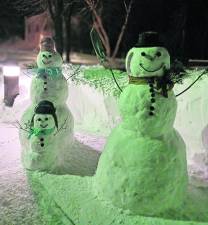 This photo submitted by reader Janet Baker shows a snowman and its family that she built during the snowstorms on Jan. 22 and Jan. 25.