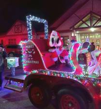 Santa arrives on a firetruck at the Christmas tree lighting ceremony Friday, Dec. 2 in Hardyston.