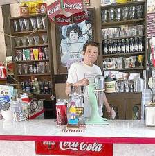 Vin DePeppo serves up classic cola in his retro man cave.