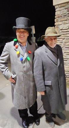 Township Council members Stan Kula, left, and Frank Cicerale are dressed for the weather and the holiday.