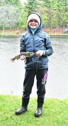 <b>Avery Garrigan of Hampton shows off her catch.</b>