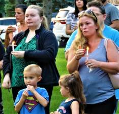 Cathy Guida, of Morris Plains, holds her candle at a vigil for Christine Solaro, 37, who was allegedly fatally shot by estranged husband Acting Newark Police Lt. John Formisano on July 14.