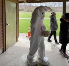 The Easter Bunny greets the children.