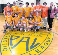<b>Members of the Vernon PAL Co-Ed Grades 6–8 basketball team celebrate after winning the league championship game March 5 at the Vernon PAL building. The team captured the title following a hard-fought season in the local youth league.</b>