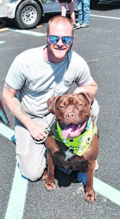 Dan Garrett of Wantage isshown with his dog, Rusty.