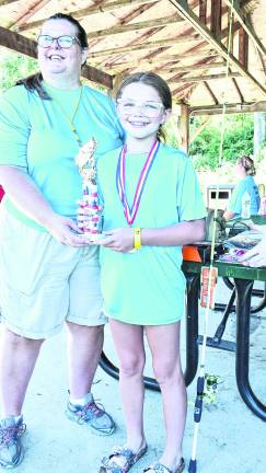 Macie Barry of Wantage won a medal for a 14-inch catfish, the largest fish medal.
