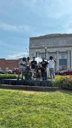 Juneteenth performers and organizers, top row from left, are Farrakhan Khaliq, True God, Lorant Mena and Samad Savage and, bottom row from left, True Prnc, Dollerie and Scott Paul. (Photo by Luke Rowe)