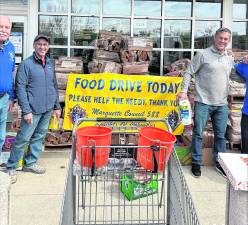 Members of the Knights of Columbus Council 588 collect food.