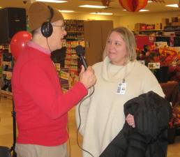 WSUS DJ Steve Andrews speaks on air with Director of Social Services Joan Bruseo.