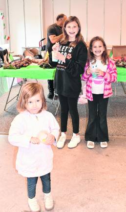 Lucia, Annabella and Marissa Monte of Hackettstown eat ice cream.