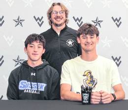 From left, Ryan Miller, Coach Connor Kopnik and Tyler Haberstroh pose for a photo.