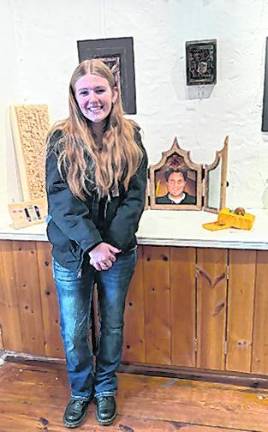 Destiny Cerracchio is shown with her piece, With You, honoring her late uncle.